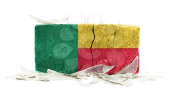 Brick with broken glass, violence concept, flag of Benin