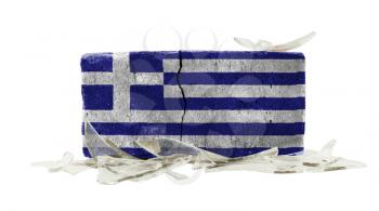Brick with broken glass, violence concept, flag of Greece