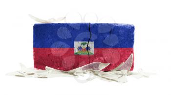 Brick with broken glass, violence concept, flag of Haiti