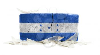 Brick with broken glass, violence concept, flag of Honduras