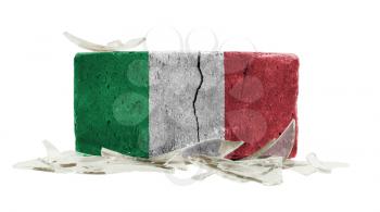 Brick with broken glass, violence concept, flag of Italy