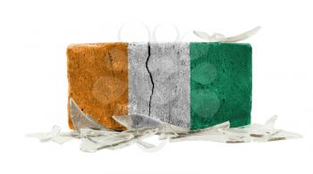 Brick with broken glass, violence concept, flag of Ivory Coast