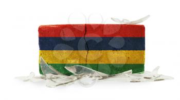 Brick with broken glass, violence concept, flag of Mauritius