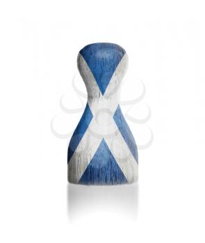 Wooden pawn with a painting of a flag, Scotland