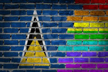 Dark brick wall texture - coutry flag and rainbow flag painted on wall - Saint Lucia