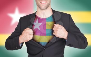 Businessman opening suit to reveal shirt with flag, Togo