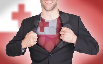 Businessman opening suit to reveal shirt with flag, Tonga