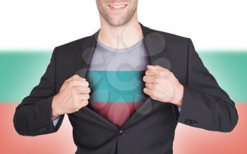 Businessman opening suit to reveal shirt with flag, Bulgaria