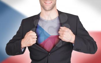 Businessman opening suit to reveal shirt with flag, Czech Republic
