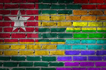Dark brick wall texture - coutry flag and rainbow flag painted on wall - Togo