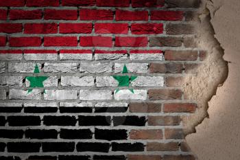Dark brick wall texture with plaster - flag painted on wall - Syria
