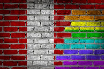 Dark brick wall texture - coutry flag and rainbow flag painted on wall - Peru
