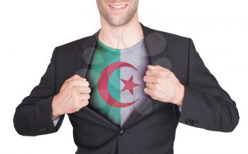 Businessman opening suit to reveal shirt with flag, Algeria
