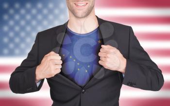 Businessman opening suit to reveal shirt with state flag (USA), Alaska