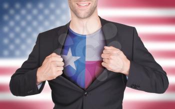 Businessman opening suit to reveal shirt with state flag (USA), Texas