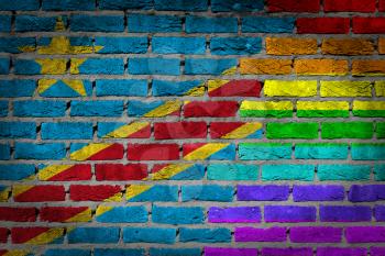 Dark brick wall texture - coutry flag and rainbow flag painted on wall - Congo