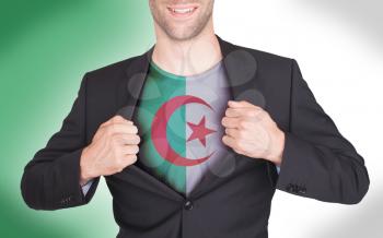 Businessman opening suit to reveal shirt with flag, Algeria