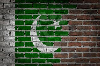 Very old dark red brick wall texture with flag - Pakistan