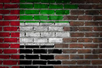 Dark brick wall texture - flag painted on wall - UAE