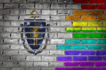 Dark brick wall texture - coutry flag and rainbow flag painted on wall - Massachusetts