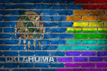 Dark brick wall texture - coutry flag and rainbow flag painted on wall - Oklahoma