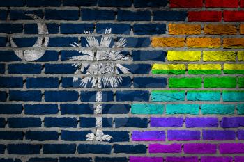 Dark brick wall texture - coutry flag and rainbow flag painted on wall - South Carolina