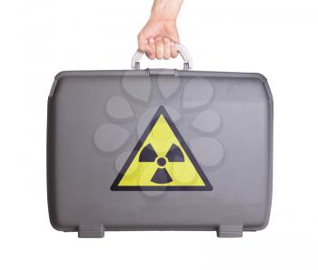 Used plastic suitcase with stains and scratches, danger, radiation