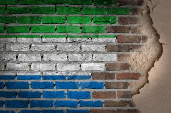 Dark brick wall texture with plaster - flag painted on wall - Sierra Leone