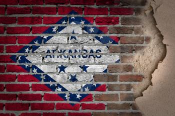 Dark brick wall texture with plaster - flag painted on wall - Arkansas