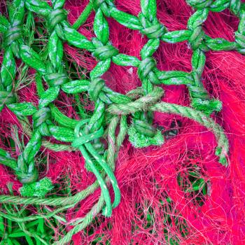 Abstract background with a pile of fishing nets ready to be cast overboard for a new days fishing