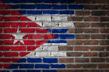 Very old dark red brick wall texture with flag - Cuba