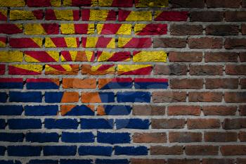 Very old dark red brick wall texture with flag - Arizona