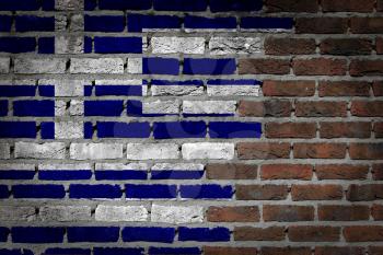 Very old dark red brick wall texture with flag - Greece