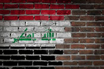 Very old dark red brick wall texture with flag - Iraq