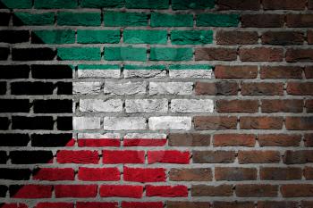 Very old dark red brick wall texture with flag - Kuwait