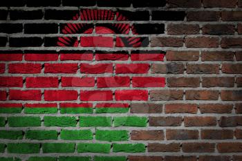 Very old dark red brick wall texture with flag - Malawi