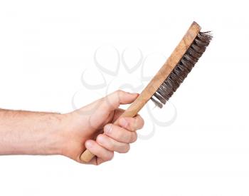 Isolated steel brush in male hand, on white