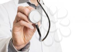 Close up of a Doctor's hand, holding a stethoscope outstretched towards the viewer