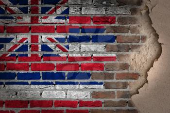 Dark brick wall texture with plaster - flag painted on wall - Hawaii