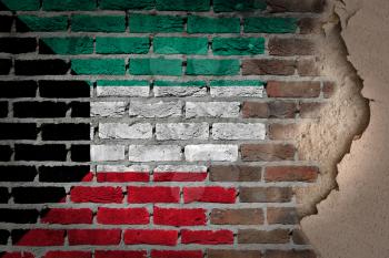 Dark brick wall texture with plaster - flag painted on wall - Kuwait