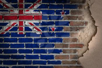 Dark brick wall texture with plaster - flag painted on wall - New Zealand