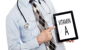 Doctor, isolated on white backgroun,  holding digital tablet - Vitamin A