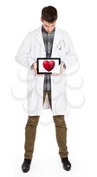 Doctor holding tablet, isolated on white - Red heart