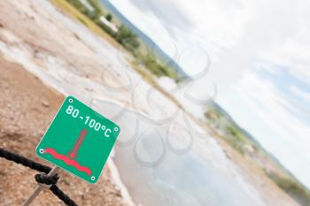 Sign, caution hot! - Erupting Geysir on Iceland