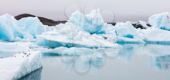 Jokulsarlon is a large glacial lake in southeast Iceland - Ice breaking of a glacier