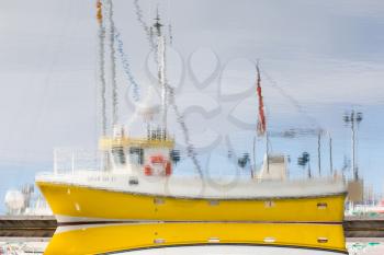 Reflection of a small fishing vessel, Iceland