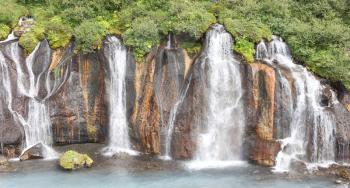 Hraunfossar waterfalls and cascade, a popular tourist destination in western Iceland