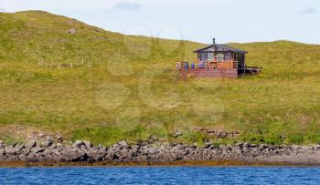 Single house on an small island at the westcoast of Iceland