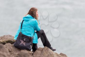 Shot of a young woman enjoying the Icelandic landscape