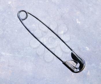 Regular safety pin on an isolated background